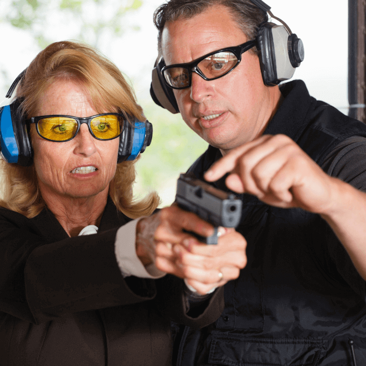 a picture of firearm training between an instructor and student