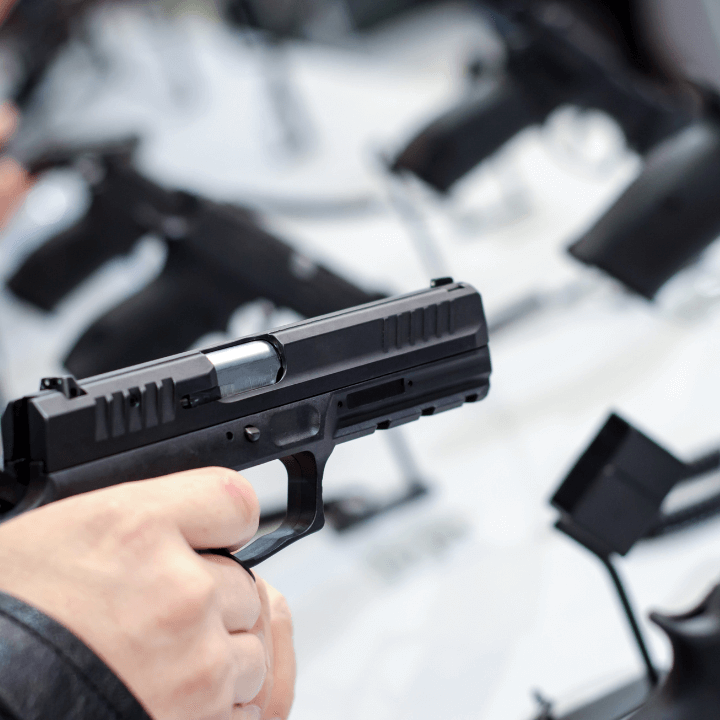 A picture of someone holding a handgun.