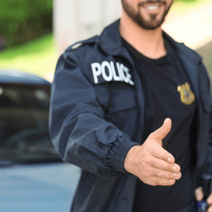 A police officer coming in to give a handshake